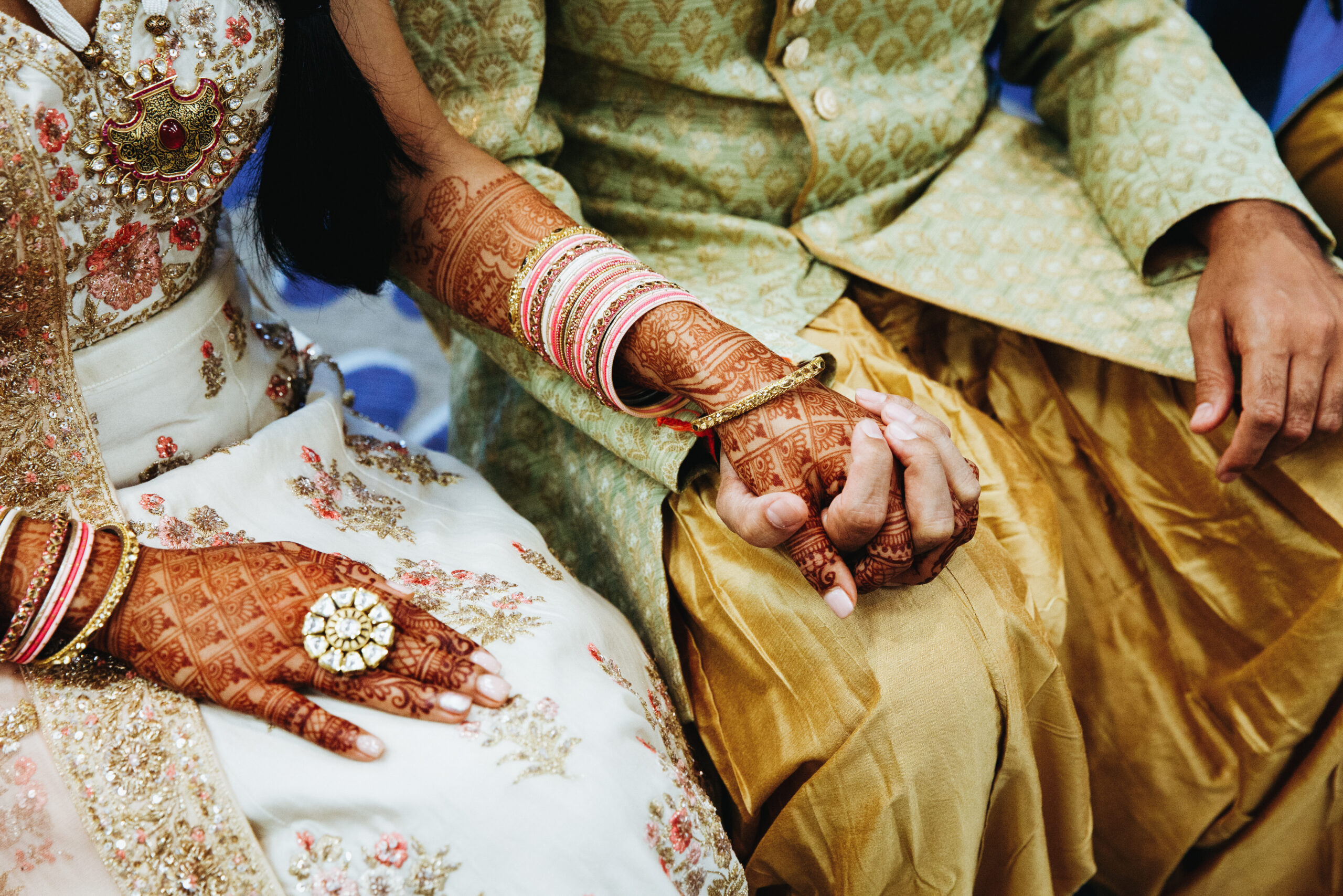 Front view of indian wedding couple are holding hands